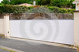 Portal aluminum sliding white metal gate of modern suburb house entrance