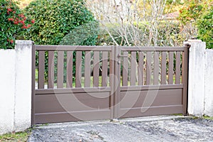 Portal door residential brown brown home suburb metal aluminum house gate street wall