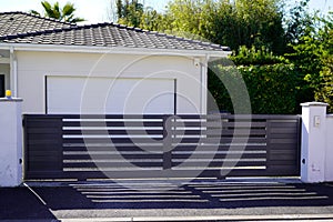 Portal door residential brown sliding home suburb metal aluminum house slide gate street wall