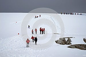 A few small red flags are placed on the thick ice field to guide visitors.