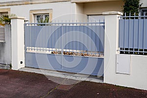 Portal retro grey classic metal home gate at entrance of classic old ancien house garden door