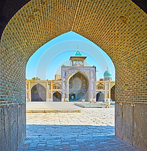 The portal of Seyed Mosque through the arch, Isfahan, Iran