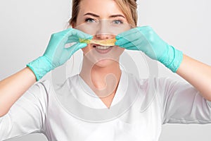 Portarit of woman with sugar paste like mustache photo