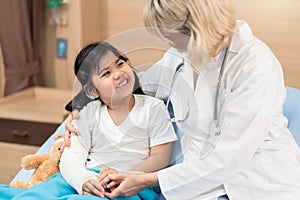 Portarit of smaile doctor pediatrician and little girl patient