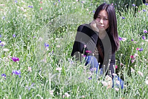 Portarit Thai woman with purple flower garden photo