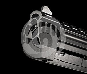 Barrel of a gun on black