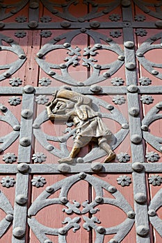 Porter on the doors to Catalan Gothic church Santa Maria del Mar, Barcelona, Spain