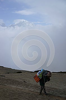 Porter and Mountains in Thokla