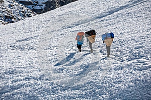 Porters crossing Cho La pass in Everest region, Nepal