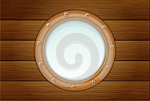 Porthole on wooden wall photo