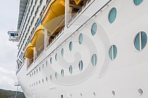 Portholes Beneath Lifeboats