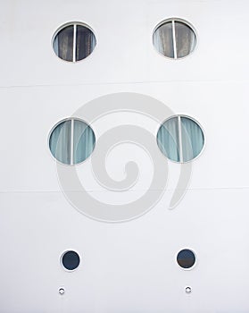 Portholes on White Cruise Ship