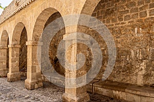 Portico with arches at Almudaina Castle main entrance in old Eivissa, Ibiza