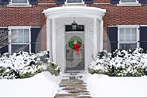 portico entrance and Christmas wreath on front door