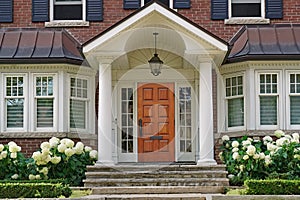 portico entrance and hydrangea flowers