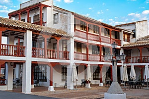 Porticoed Constitution Square in the village of Puerto Lapice, Castilla la Mancha, Spain photo