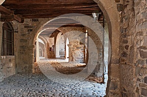 Porticos along Via Mercatorum, Cornello dei Tasso, ancient medieval village, Camerata Cornello, Lombardy, Italy photo