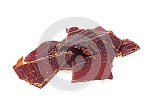 Portion of beef jerky isolated on white background, close-up