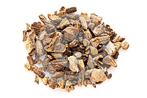 Portion of chopped dried burdock roots on white photo