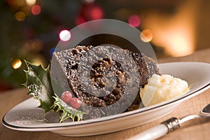 Portion of Christmas Pudding with Brandy Butter photo