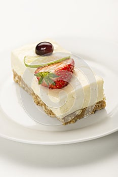 Portion of creamy lemon or lime cheesecake