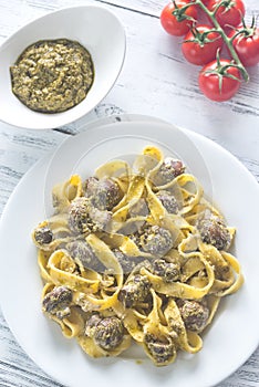 Portion of creamy mushroom pasta with pesto