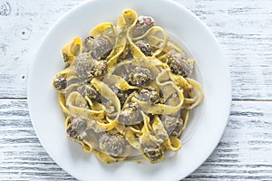 Portion of creamy mushroom pasta with pesto