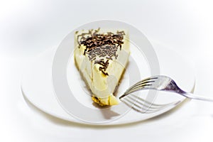 Portion of delicious chocolate cake on white background