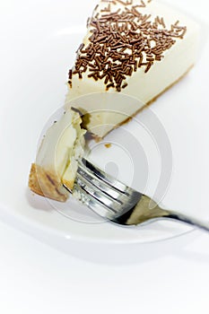 Portion of delicious chocolate cake on white background
