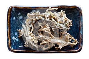 Portion of dried Iceland moss in bowl isolated