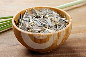 portion of dried organic lemongrass on rustic wooden table