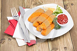 Portion of Fish Fingers on a plate