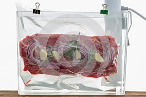 Portion of flat iron beef steak sous-vide cooking photo