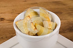 Portion of fresh baked sweet potato wedges.