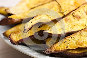 Portion of fresh baked sweet potato wedges