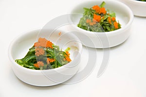 Portion of fresh wakame seaweed on a white background