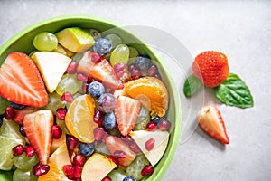 Portion fruit salad in a bowl. Healthy meal