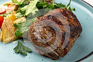 Portion of beef mignon steak with vegetables