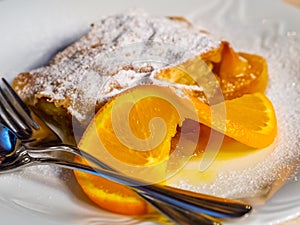 A portion of homemade strudel served in a white plate