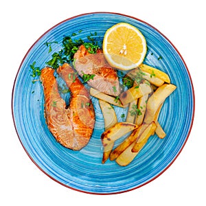 Portion of just cooked grilled salmon steak with fried potato