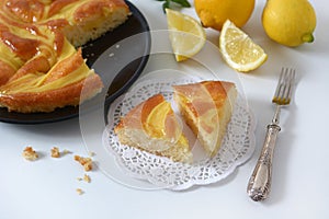 Portion of lemon pie on the white table
