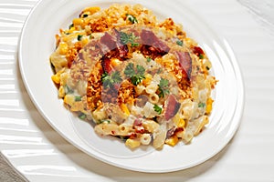 portion of macaroni and cheese with corn, bacon topped with panko breadcrumbs