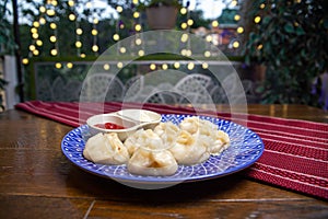 a portion of manta rays on a blue plate on the table