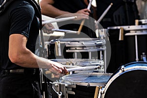 Portion of a marching band drum line performing