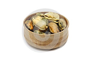 A portion of marinated sea mussels in a wooden bowl