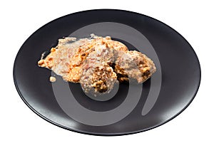 Portion of meatballs with rice on plate isolated