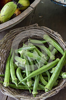 Portion of okra in wicker basket photo
