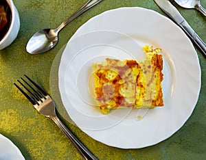 Portion of omelette on plate at eatery