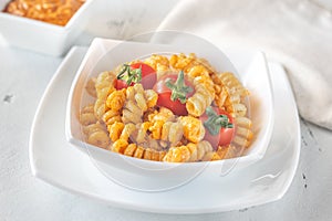 Portion of pasta with tomato and ricotta pesto