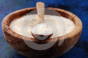 Portion of Psyllium Seeds on rustic dark background. Psyllium seed husks on wood
